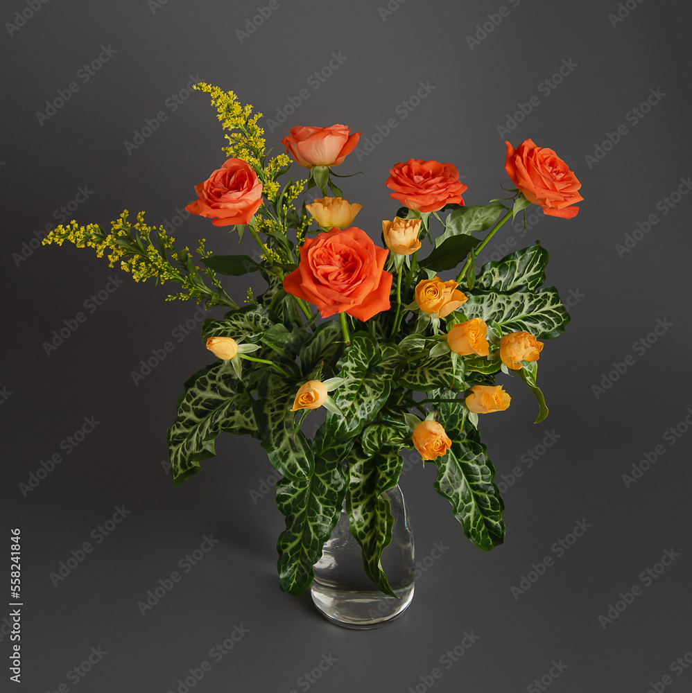 bright bouquet of roses on a gray background for postcards and congratulations to women