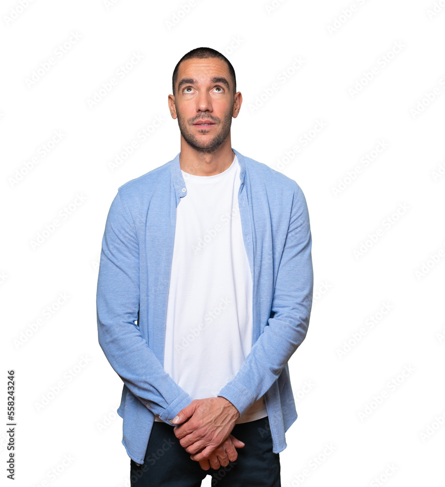 Serious young man looking against background Serious young man looking against background