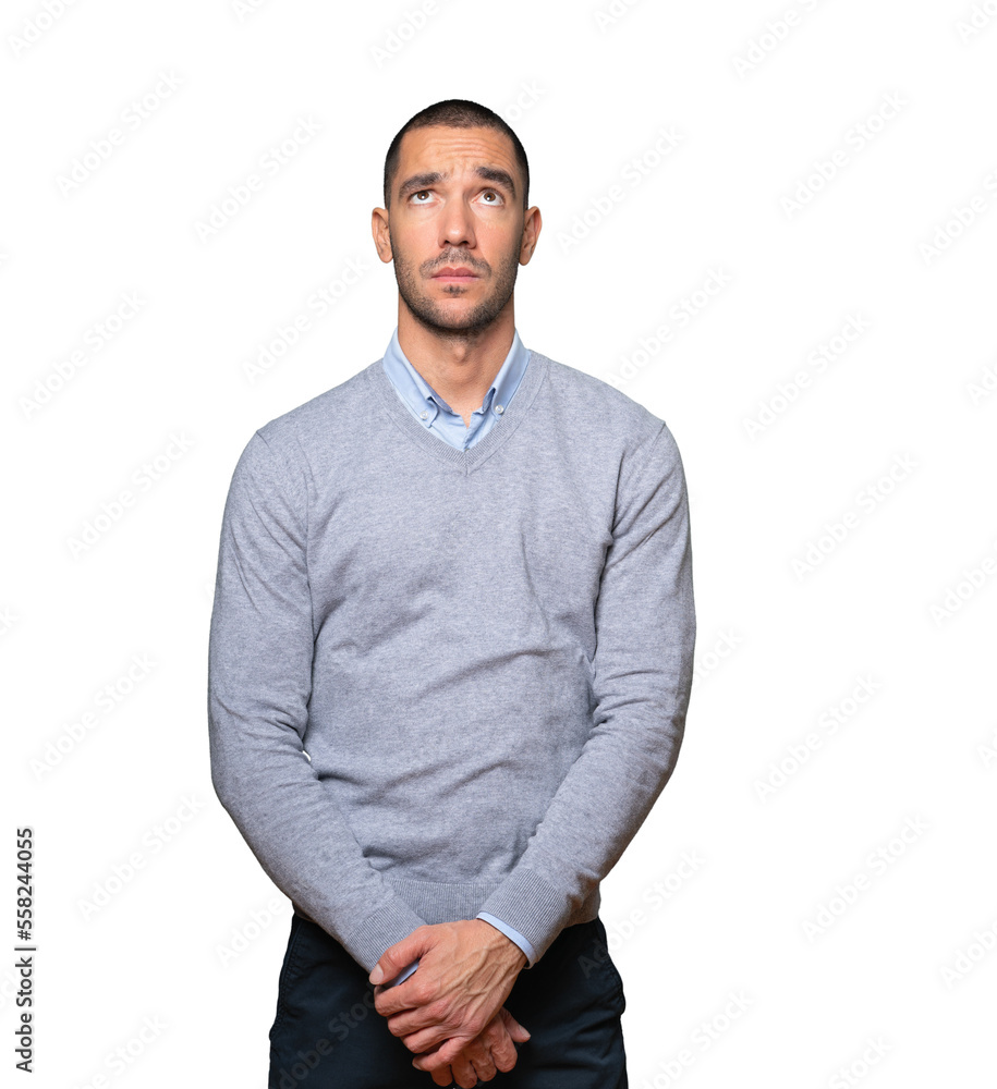 Serious young man looking against background Serious young man looking against background