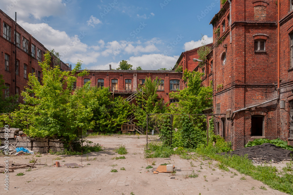 Old abandoned haunted red brick factory of stockings, pantyhose and socks in Central Europe, Poland Old abandoned haunted red brick factory of stockings, pantyhose and socks in Central Europe, Poland