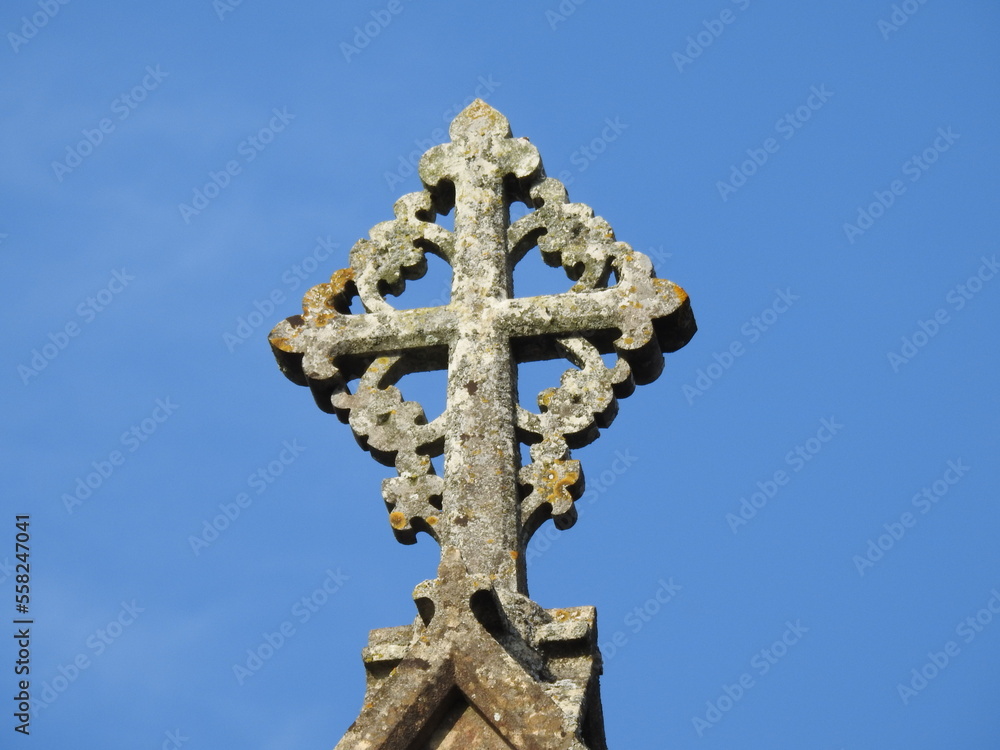 An old stone cross in the form of a square