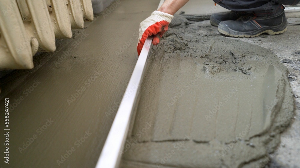 Pointing a patio with dry grouting cement grouting mix. Seeded fine