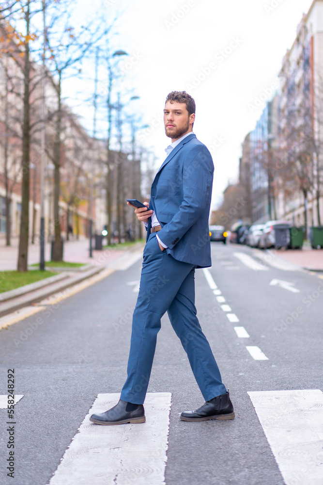 Businessman or finance man crossing a zebra crossing near the office, young entrepreneur concept