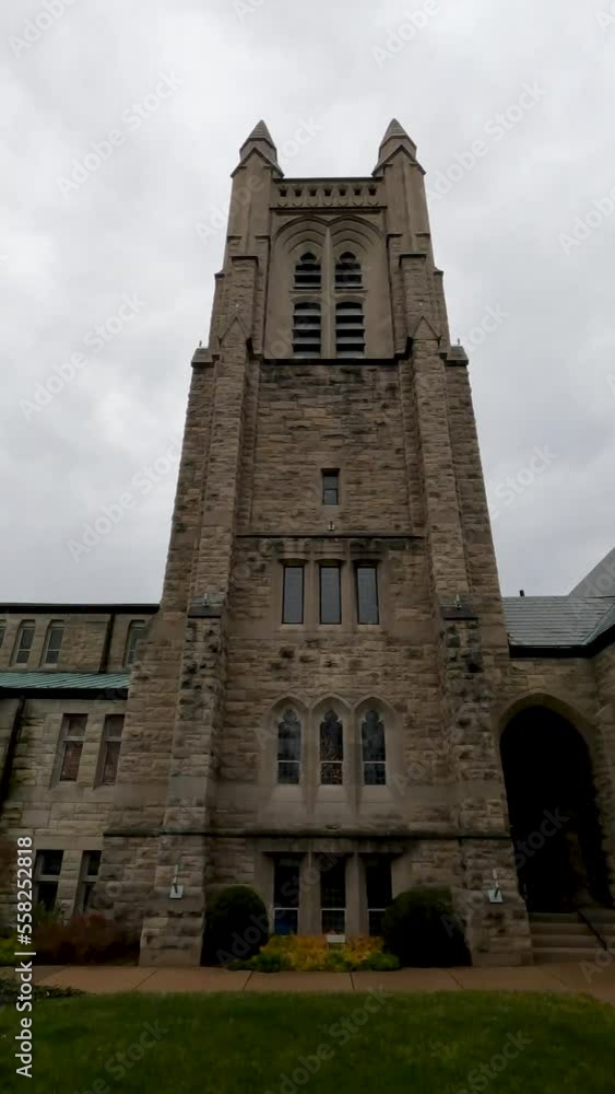 Dramatic angled views of a historic Presbyterian Church that looks like it is reaching towards Heaven. Stone architecture and stained glass windows Dramatic angled views of a historic Presbyterian Church that looks like it is reaching towards Heaven. Stone architecture and stained glass windows