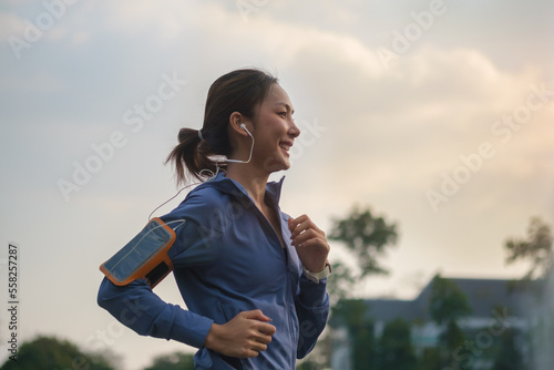 Shot of a beautiful sporty woman jogging outdoors