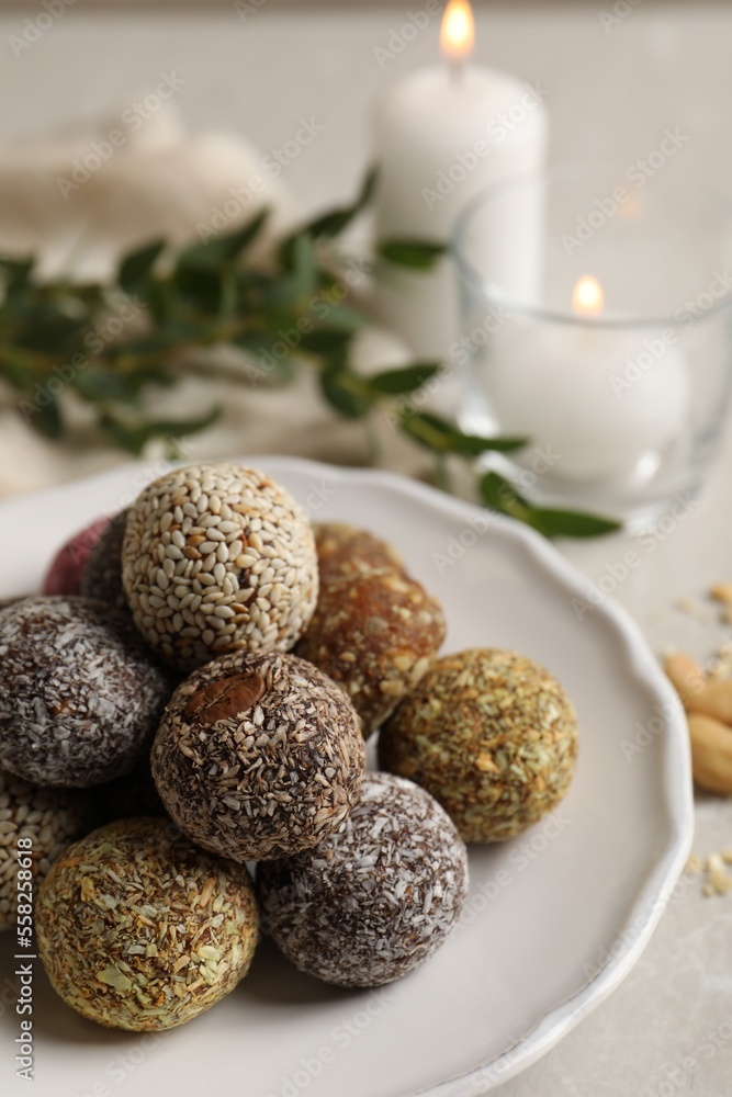 Different delicious vegan candy balls on light grey marble table Different delicious vegan candy balls on light grey marble table