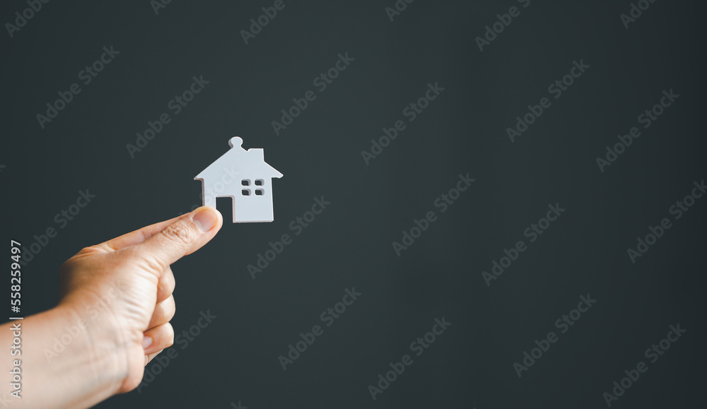 Saving investment home with loan finance money business concept. Investment banking finance for residential real estate business. Stack coins with model house for investment loans.Cash for taxes. Saving investment home with loan finance money business concept. Investment banking finance for residential real estate business. Stack coins with model house for investment loans.Cash for taxes.