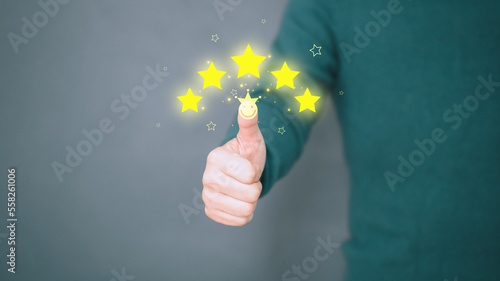 Man give positive reviews for customer satisfaction surveys, Five star rating, Customer assessment feedback, Service rating satisfaction and testimonial concept.