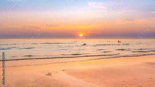 Beautiful sunset sky with calmness sea and warming ligh on the beach © F16-ISO100