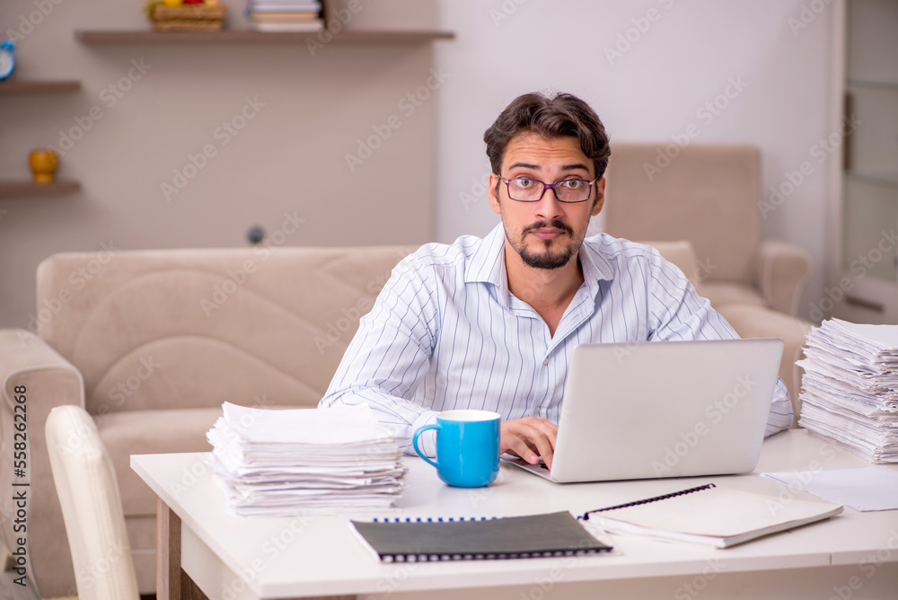 Young businessman employee working from home during pandemic