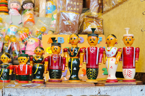 Wooden Indian dolls for sale in a souvenir shop in Tirupati, India.