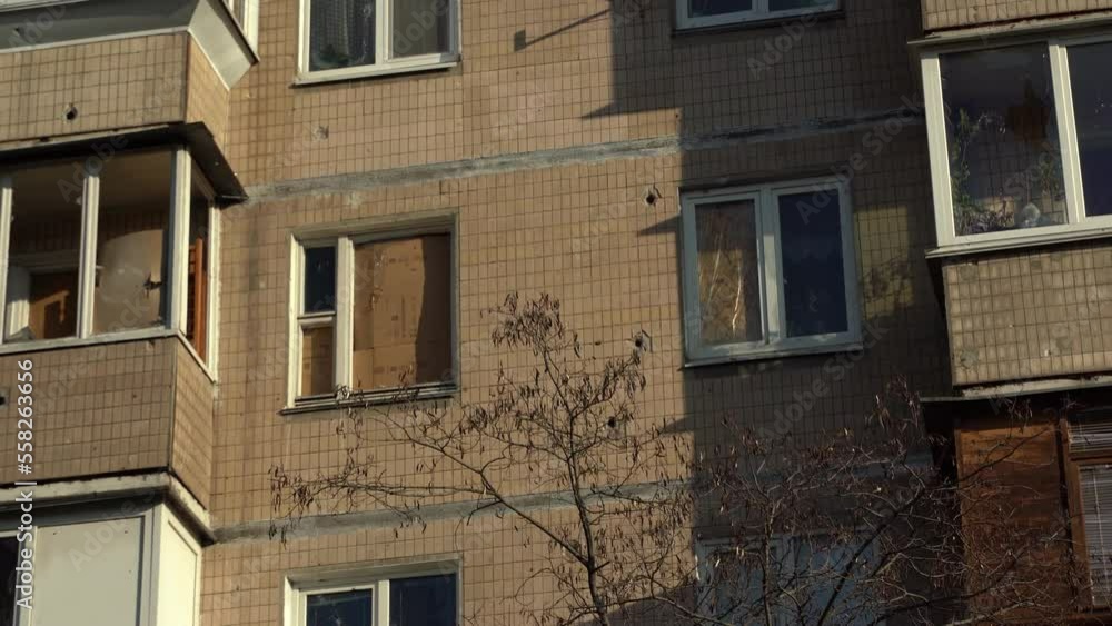 Consequences of rocket attack on the center of Ukraine. Funnel from a drone explosion. Attack of Iranian Shahed 136 drones on Kyiv. Damaged residential building. Broken windows and holes from debris. Consequences of rocket attack on the center of Ukraine. Funnel from a drone explosion. Attack of Iranian Shahed 136 drones on Kyiv. Damaged residential building. Broken windows and holes from debris.