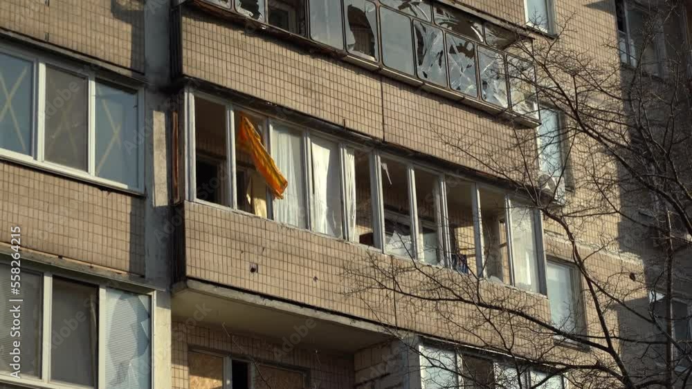 Consequences of rocket attack on the center of Ukraine. Funnel from a drone explosion. Attack of Iranian Shahed 136 drones on Kyiv. Damaged residential building. Broken windows and holes from debris. Consequences of rocket attack on the center of Ukraine. Funnel from a drone explosion. Attack of Iranian Shahed 136 drones on Kyiv. Damaged residential building. Broken windows and holes from debris.