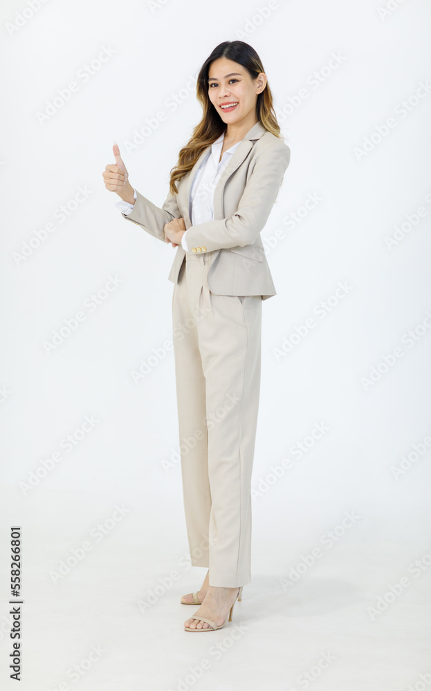 Portrait isolated cutout studio full body shot of Asian professional successful female businesswoman manager in formal suit standing smiling holding hand up presenting product on white background