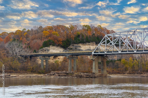 Interstate 70 Highway Truss Bridge Over the Missouri River with Bluffs and Colorful Fall Autumn Leaves photo