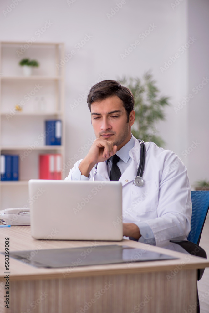 Young male doctor in telemedicine concept Young male doctor in telemedicine concept