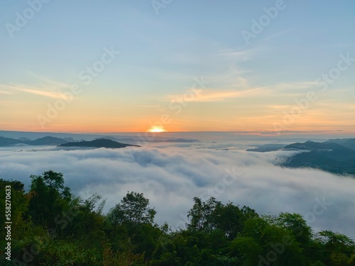 Beautiful sunrise on the Mekong River and mist at Phu Huay Isan, Nong Khai Province, Thailand