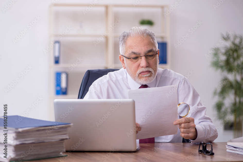 Old male employee and too much work in the office Old male employee and too much work in the office