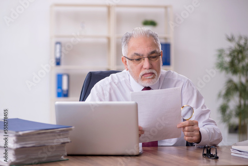 Wallpaper Mural Old male employee and too much work in the office Torontodigital.ca