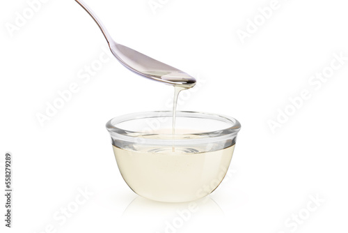 Sugar syrup in glass bowl isolated on white background  photo