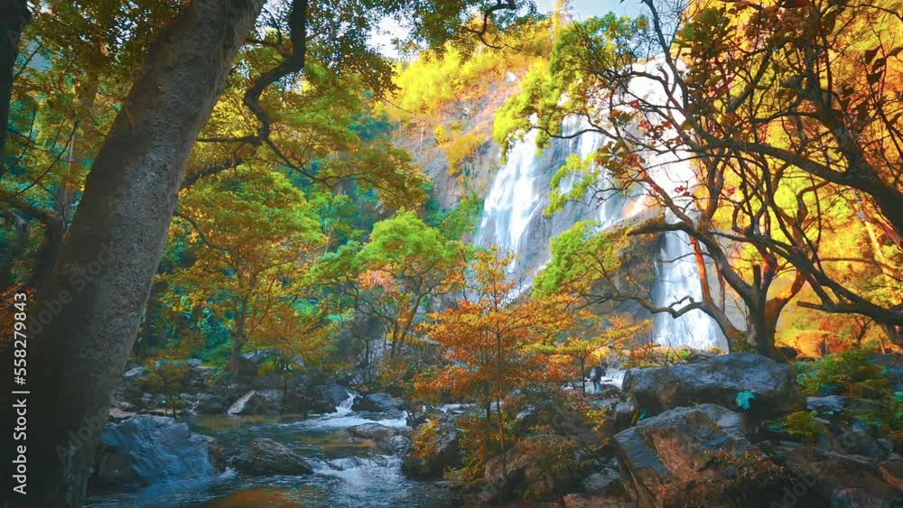 waterfall in the mountains, Khlong Lan Waterfall, Khlong Lan National Park, Kamphaeng Phet, in Thailand.Onsen atmosphere. waterfall in the mountains, Khlong Lan Waterfall, Khlong Lan National Park, Kamphaeng Phet, in Thailand.Onsen atmosphere.