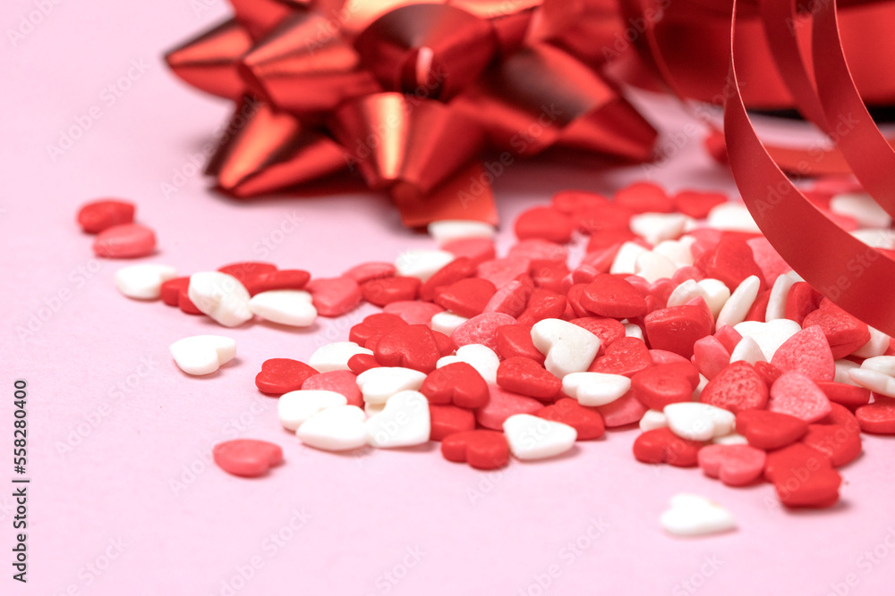 Valentine's hearts with red bows and red curly ribbon. Valentine's Day Valentine's hearts with red bows and red curly ribbon. Valentine's Day