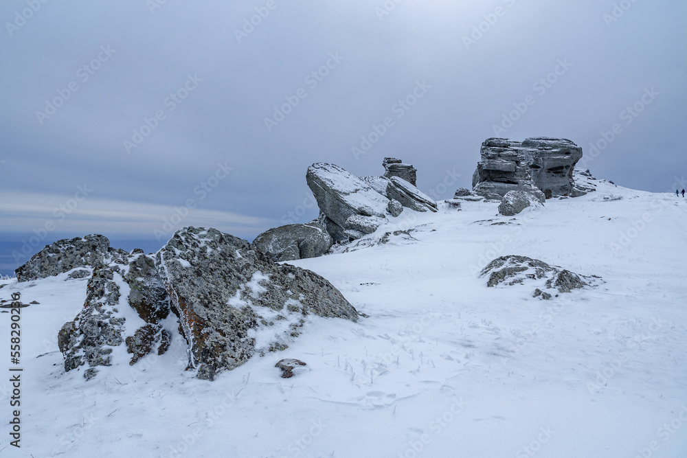 Rocks on the top of Mount Alenga. Southern Demerdzhi in snow and ice in spring. Crimea