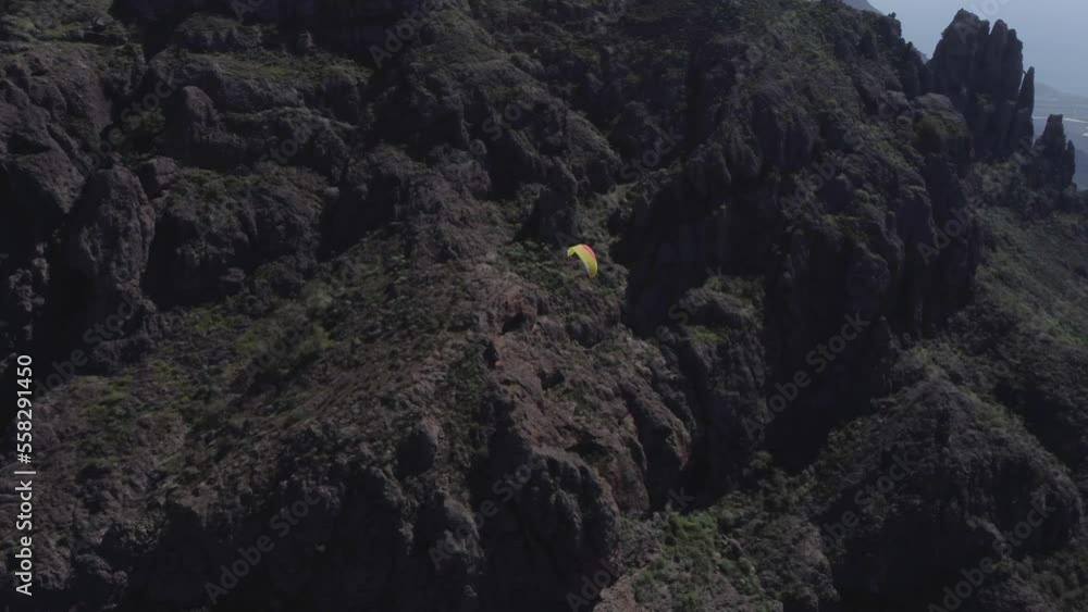Aerial View of Paragliding Parachute Flying ABove Rocky Hills, Tracking Drone Shot Aerial View of Paragliding Parachute Flying ABove Rocky Hills, Tracking Drone Shot
