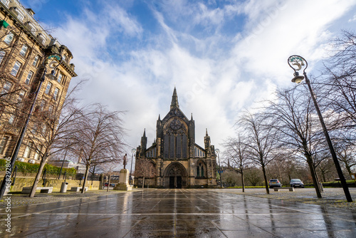 Glasglow Cathedral , The oldest cathedral church in mainland Scotland with classic gothic architecture during winter sunny day at Glasgow , Scotland : 27 February 2018 photo