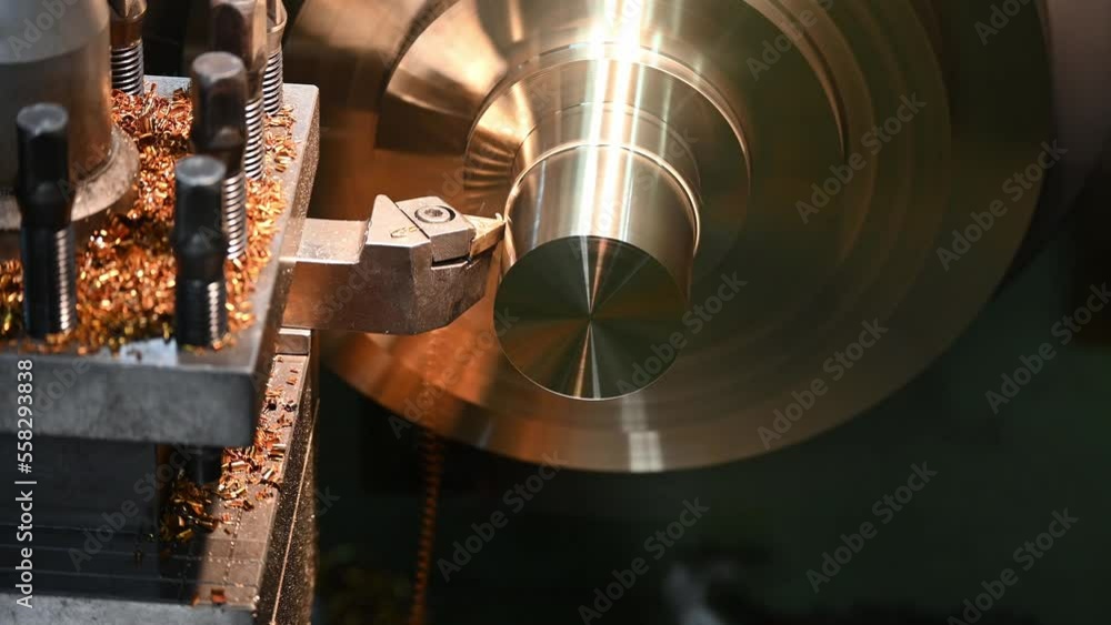Closeup scene the lathe machine finish cut the brass parts by lathe tools. Closeup scene the lathe machine finish cut the brass parts by lathe tools.