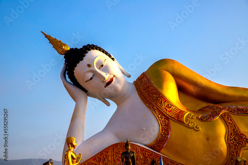 Lying Buddha statue in Wat Doi Khum temple in ChiangMai, Thailand photo