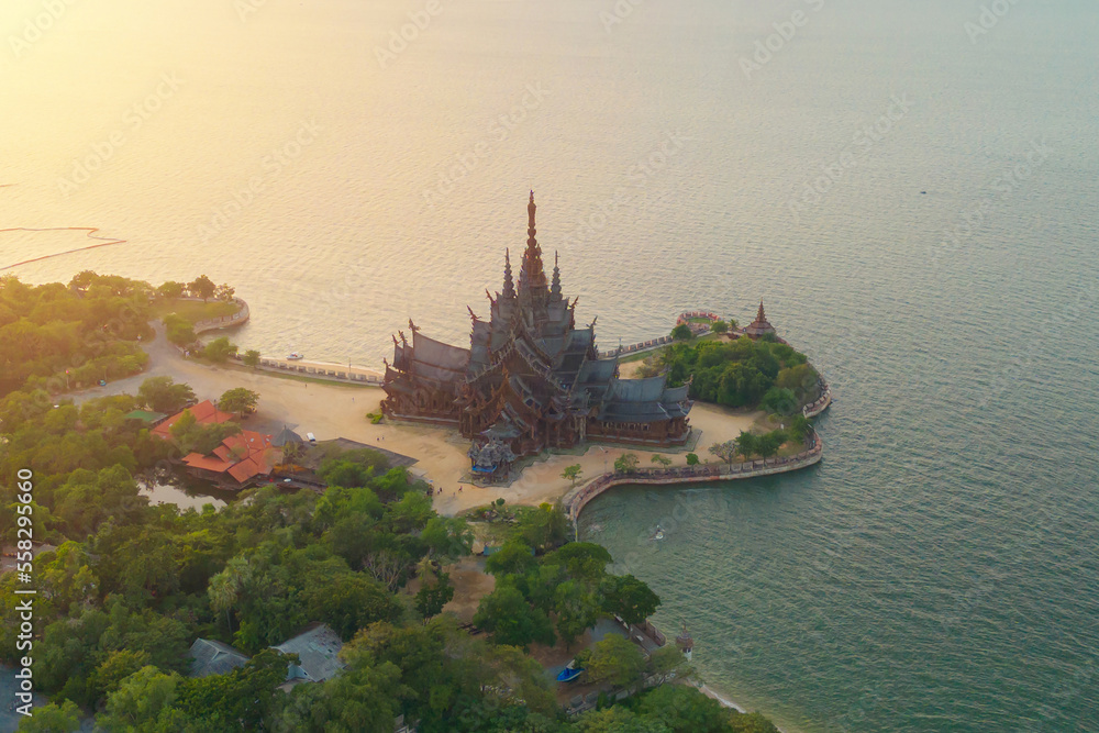 Aerial top view of Sanctuary of Truth Museum in Pattaya City with beach sea, Thailand. Temple tourist attraction landmark.