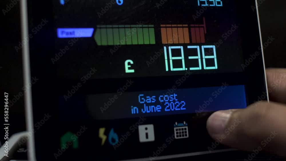 Close Up Of Finger Pressing Touchscreen Display Of UK Energy Smart Meter To Check Monthly Cost Of Gas Usage 2022. Locked Off