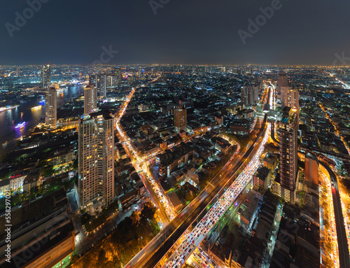 Aerial view of Bangkok Downtown Skyline, Thailand. Financial district and business centers in smart urban city in Asia. Skyscraper and high-rise buildings at night.