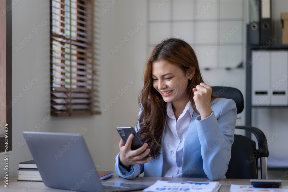 Portrait of an excited young asian girl using laptop computer and celebrating success for online. Portrait of an excited young asian girl using laptop computer and celebrating success for online.
