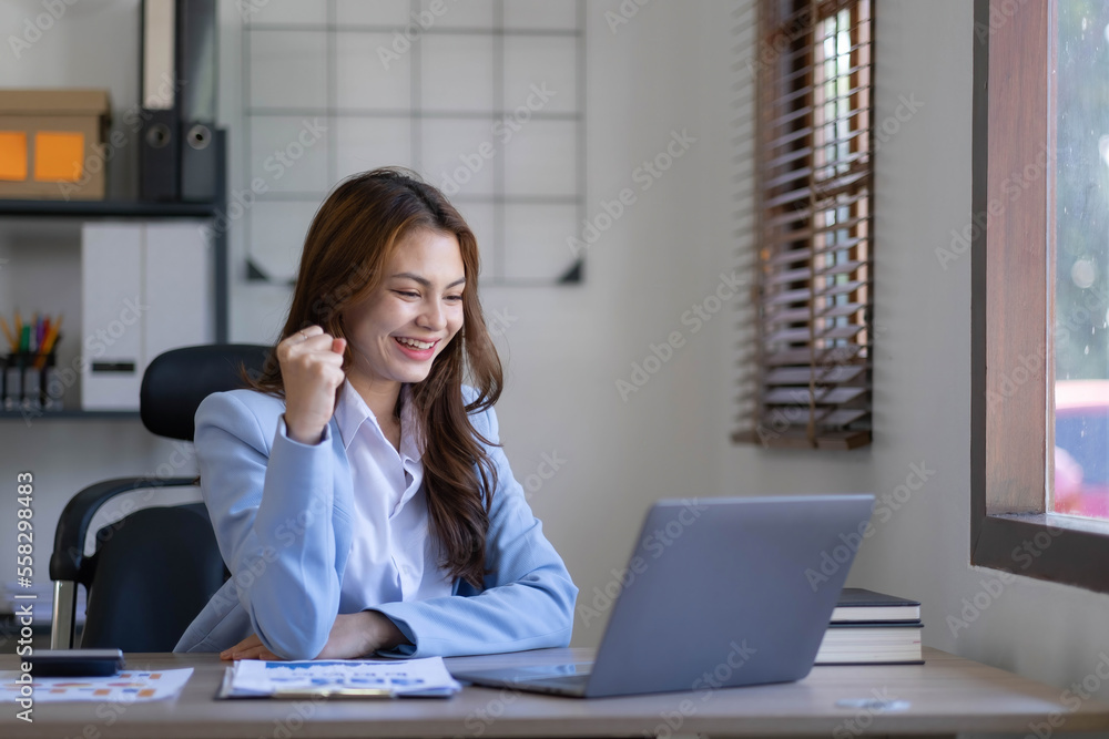 Portrait of an excited young asian girl using laptop computer and celebrating success for online. Portrait of an excited young asian girl using laptop computer and celebrating success for online.