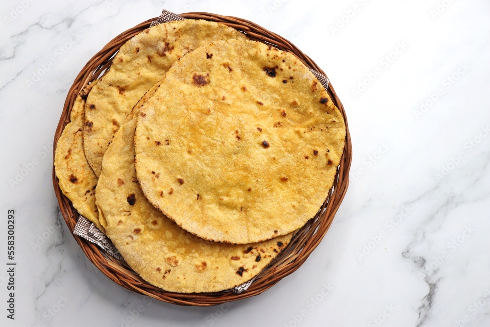 Makki di roti or Corn meal bread and mustard leaves curry. It's a popular Punjabi winter dish