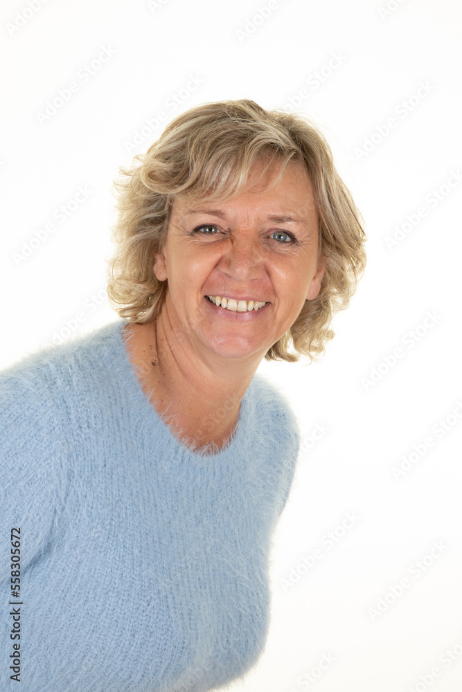 middle aged blonde beautiful happiness smile senior woman looking confident in blue sweater on white background middle aged blonde beautiful happiness smile senior woman looking confident in blue sweater on white background