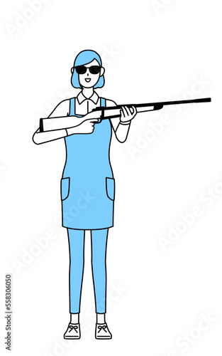 サングラスをかけてライフル銃を持つエプロンを着た女性