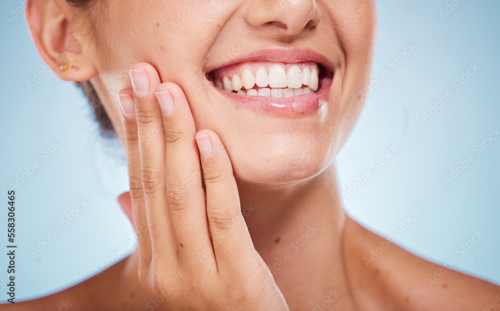 Beauty, teeth and face with woman and hand for manicure, nail care and cosmetics facial, Invisalign and skincare against studio background. Healthy skin, wellness and dermatology with teeth whitening Beauty, teeth and face with woman and hand for manicure, nail care and cosmetics facial, Invisalign and skincare against studio background. Healthy skin, wellness and dermatology with teeth whitening