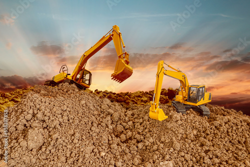 Crawler Excavator is digging in the construction site ,on a sunset backgrounds .