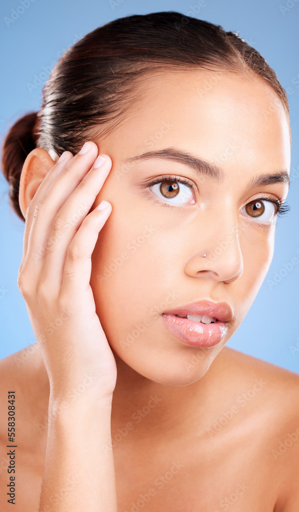 Portrait, skincare and woman with natural beauty, cosmetics and on blue studio background. Face, female and girl with makeup, treatment for glow and luxury routine for smooth, clear and soft skin.