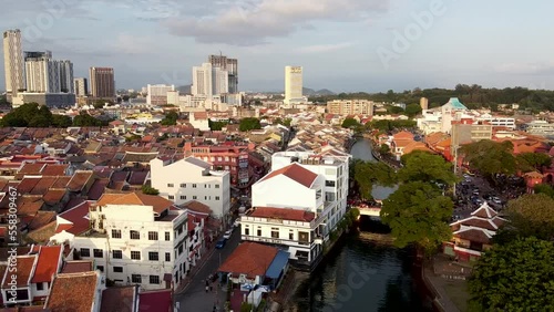 MALACCA, MALAYSIA - DECEMBER 29, 2019: Malacca aerial view at sunset. Sky colors over Melaka city skyscrapers photo