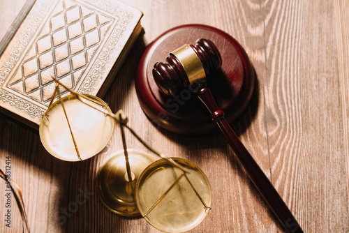 Business and lawyers discussing contract papers with brass scale on desk in office. Law, legal services, advice, justice and law concept picture with film grain effect