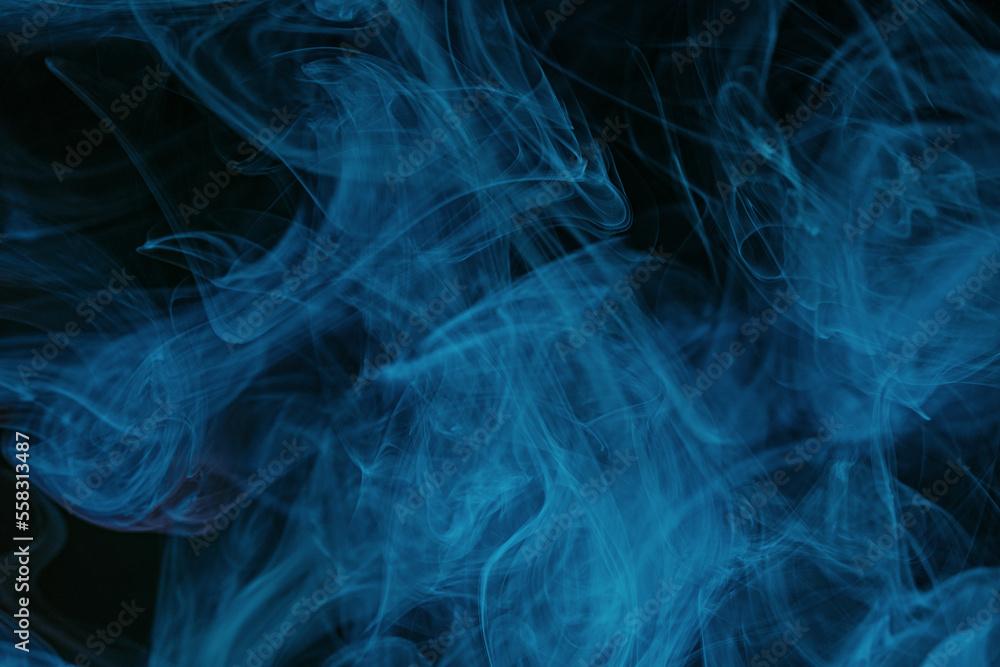 Abstract swirling smoke texture on black background