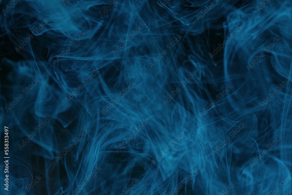 Abstract swirling smoke texture on black background