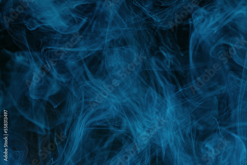 Obraz na płótnie Abstract swirling smoke texture on black background w salonie