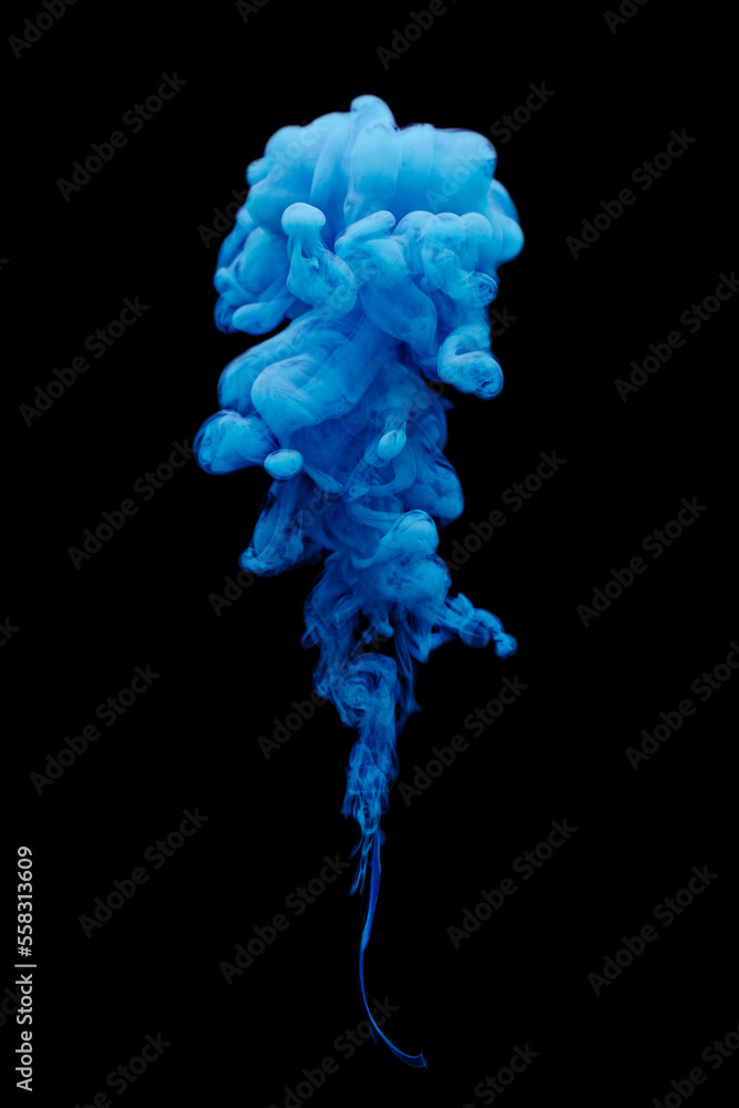 Blue ink swirling in water isolated on black background