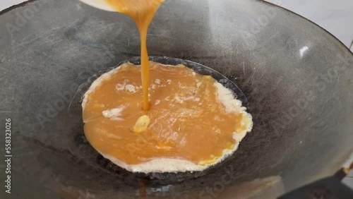 Omelet on hot pan on food background