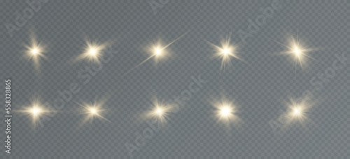 Golden particles of light. Golden light. Light flare.Stars isolated on transparent background.